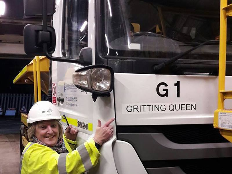 Amey employee stood next to a gritter.