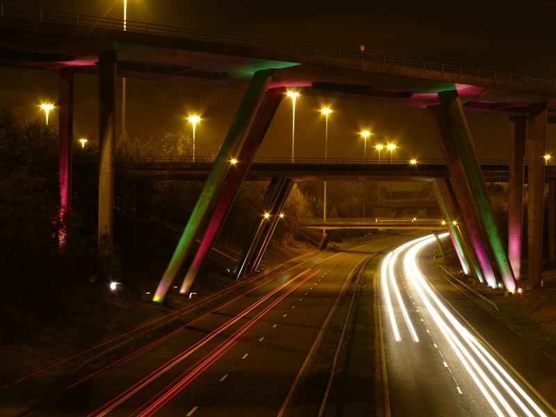 Image under a bridge at night.