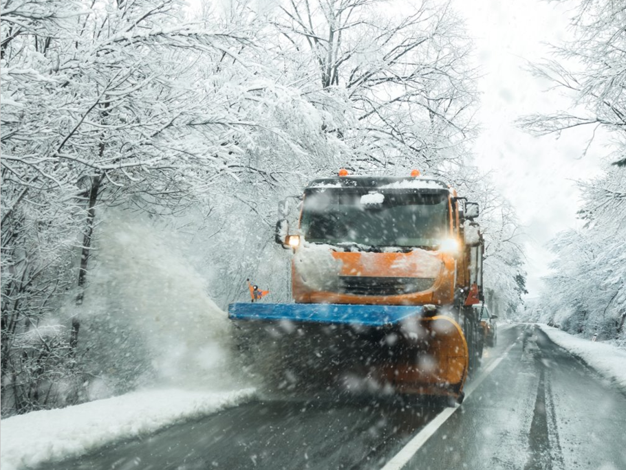 Image of gritters on a rural road in the snow
