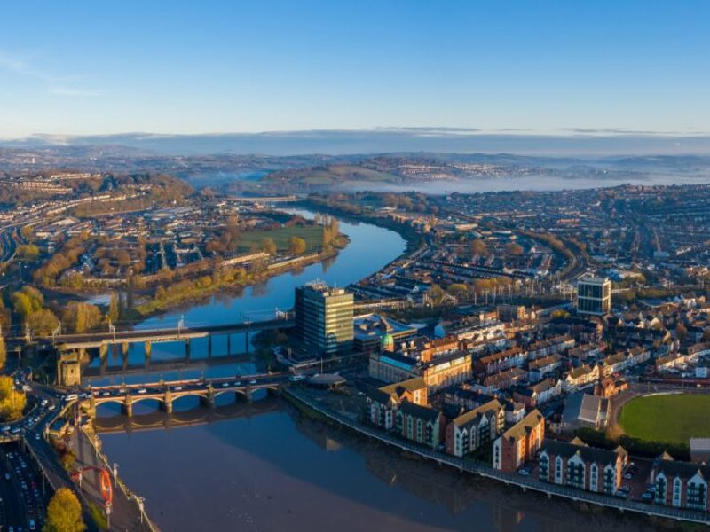 Cityscape with a bridge over a wide river