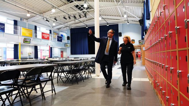 Two Amey employees inside a hall