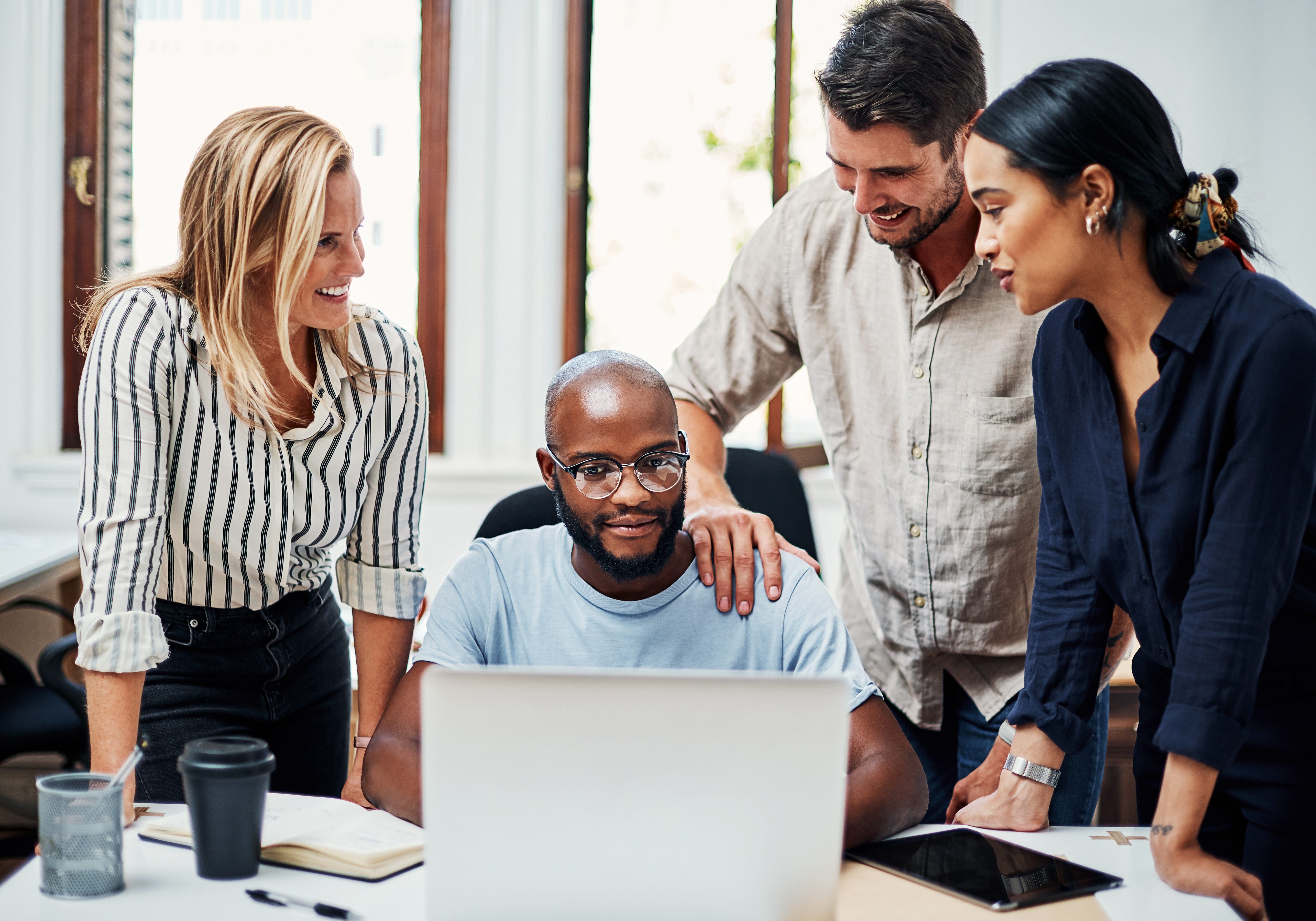 Image of people working together at a desk