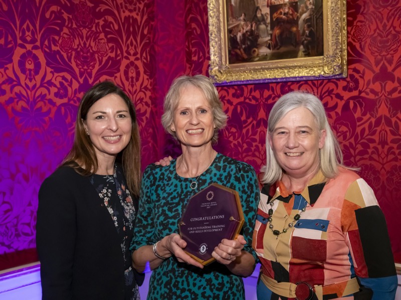 Three Amey Employees, holding an award