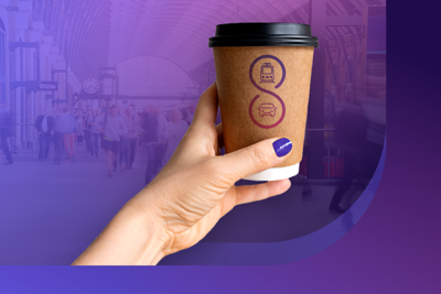 Image of a hand holding a coffee cup