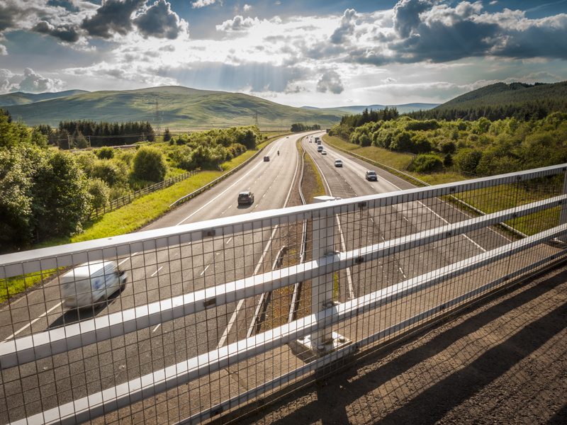 Image taken from a bridge of a highway.