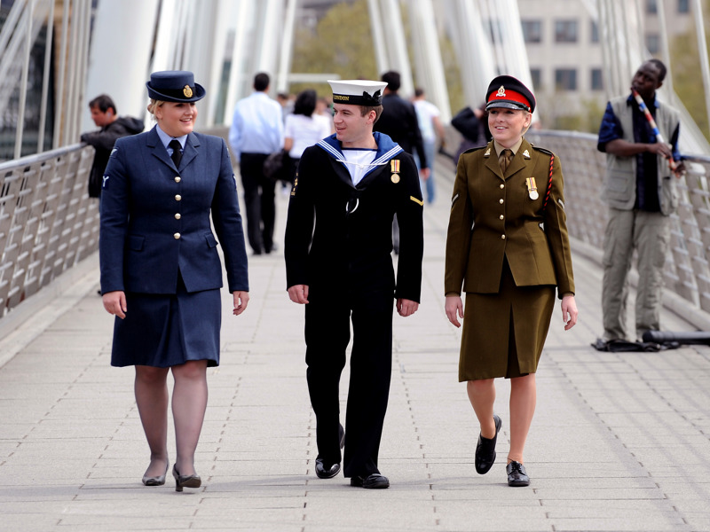 Image of military personnel on a bridge.