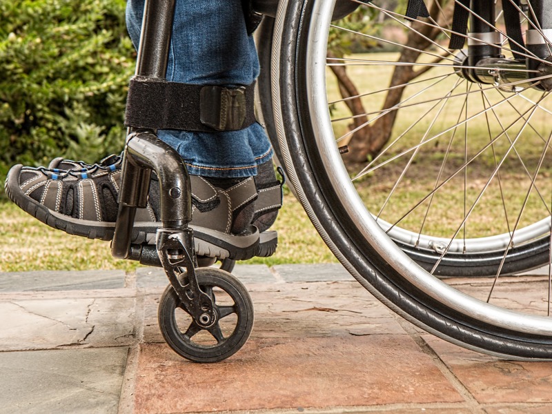 Snippet of the bottom of a wheelchair.