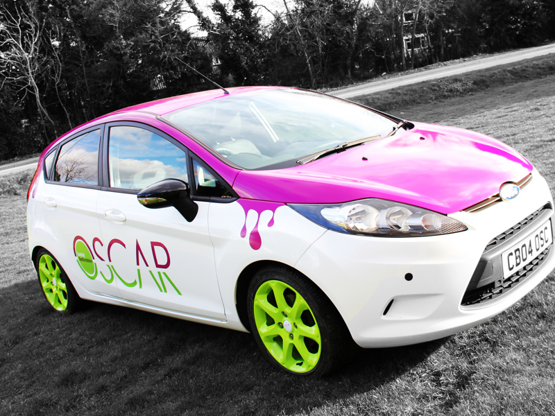 a pink and white 'Oscar' car.
