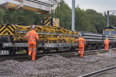 Men in PPE on a rail track