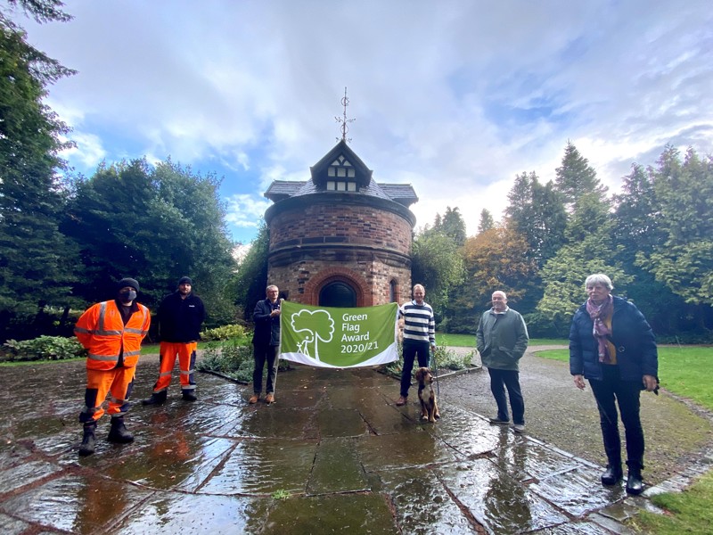 Image of Amey employees holding a green flag award banner.