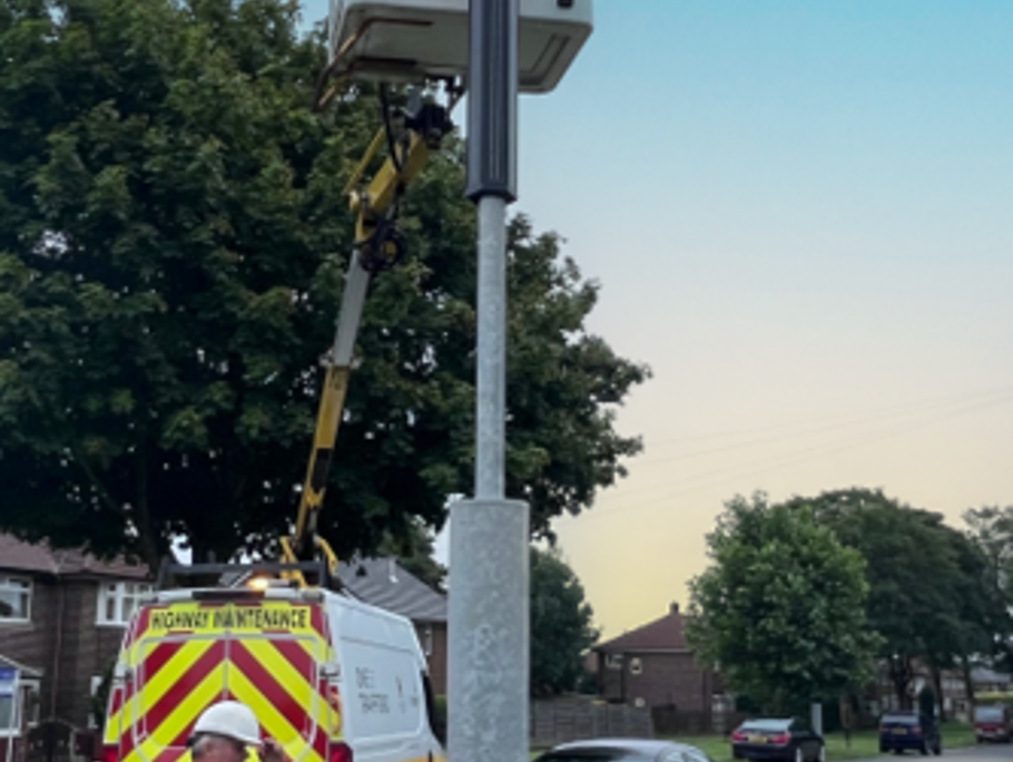 Image of solar hybrid street lighting being fitted.