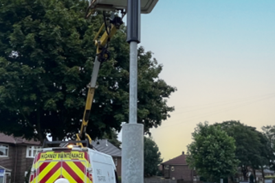 Image of solar hybrid street lighting being fitted.