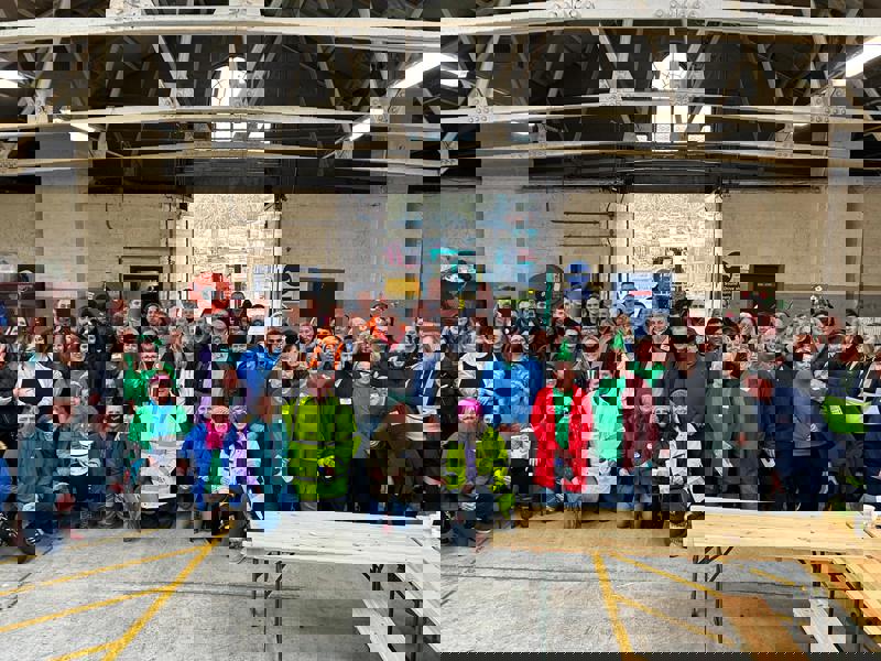 a group shot of people in a warehouse.