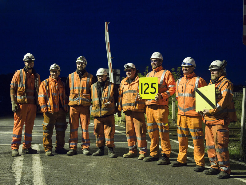 A group of men wearing PPE.