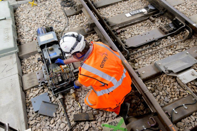 Image of an Amey employee working on a rail side