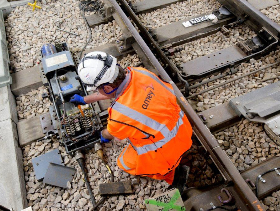 Image of an Amey employee working on a rail side