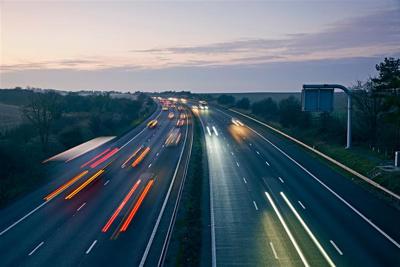 Image of a highway, at dusk.