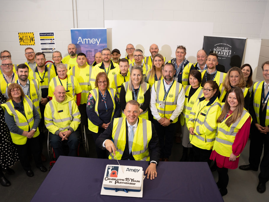 Image of Amey employees celebrating 15 years of partnership with RBLI.