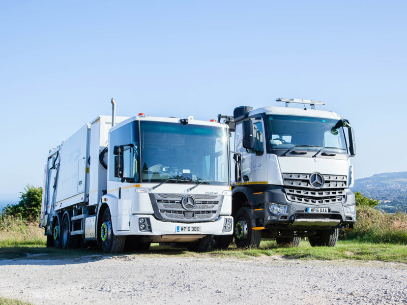 Image of two Amey recycling vans.