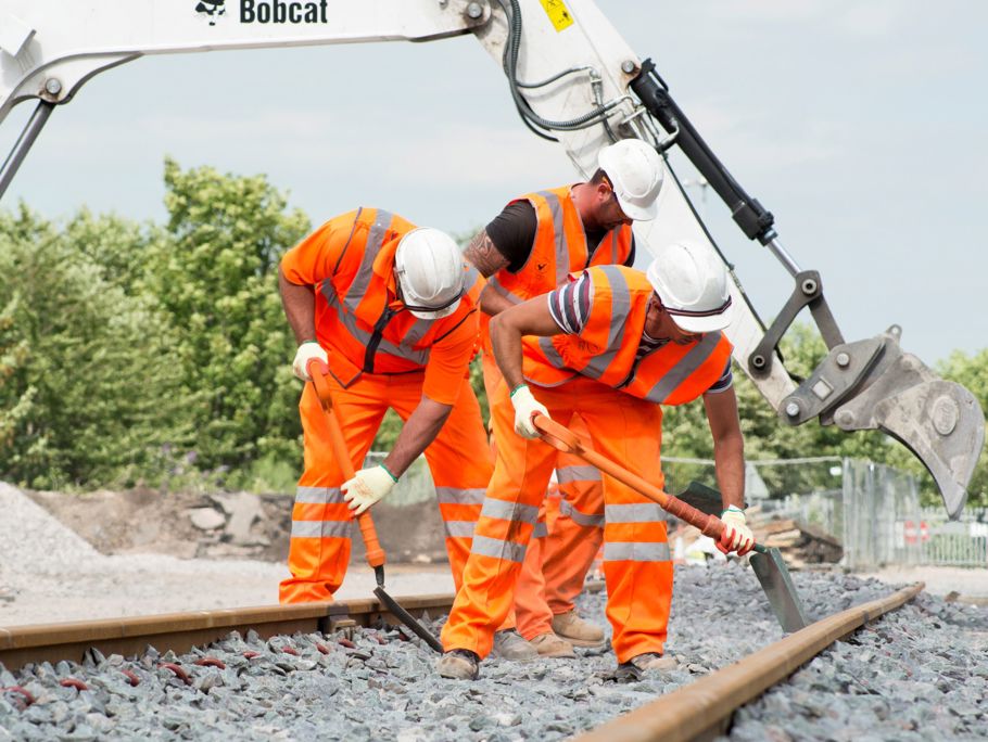 Amey employees working on a rail way.